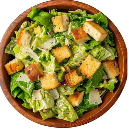 Caesar Salad — Romaine lettuce with crispy croutons, Parmesan, bacon, and signature dressing